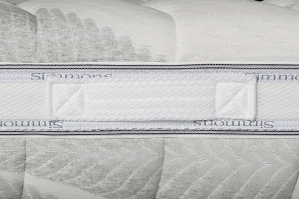 Simmons Premium Natural, fascia perimetrale con logo e maniglia